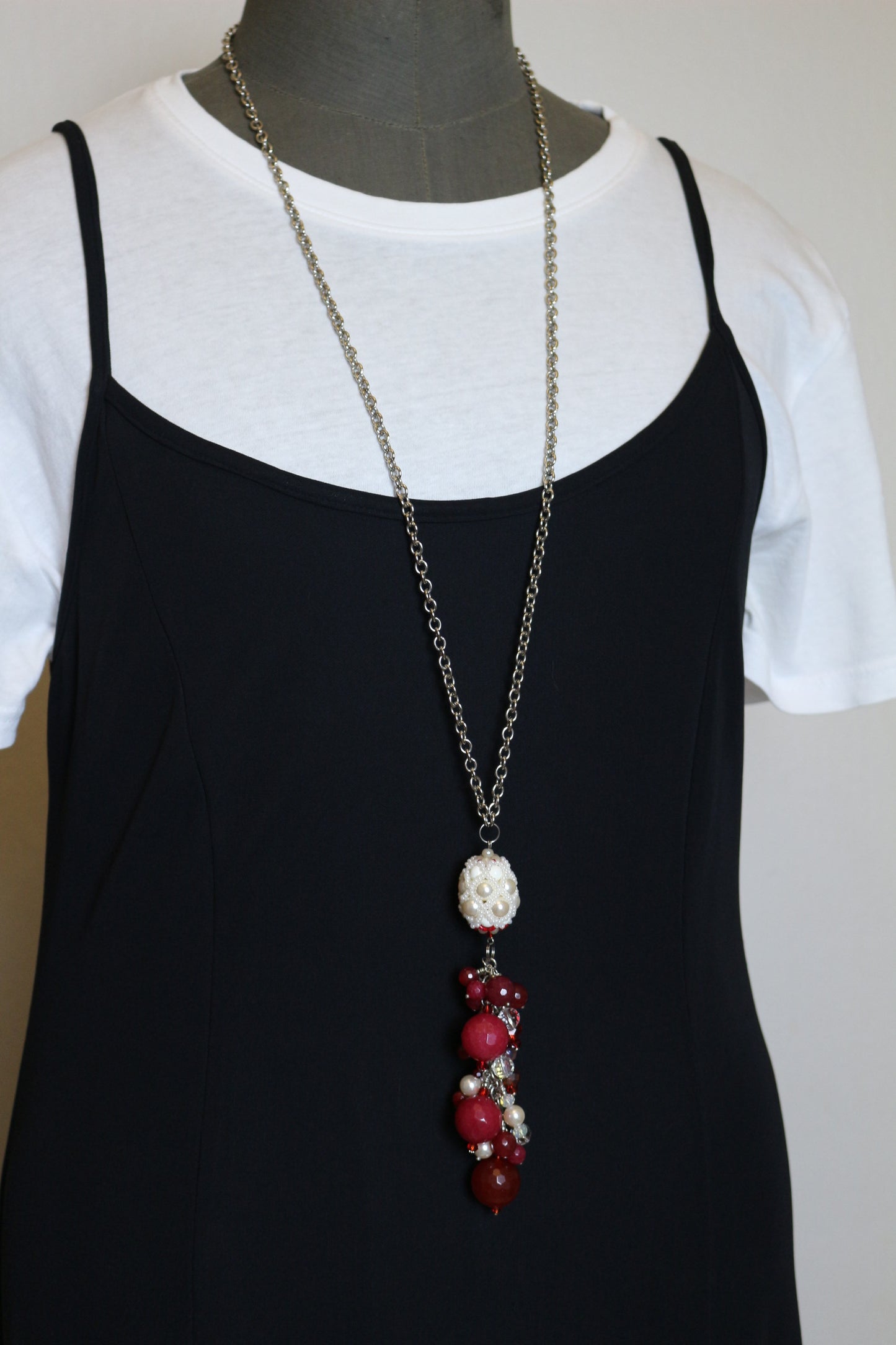 Necklace with red ruby and beaded element