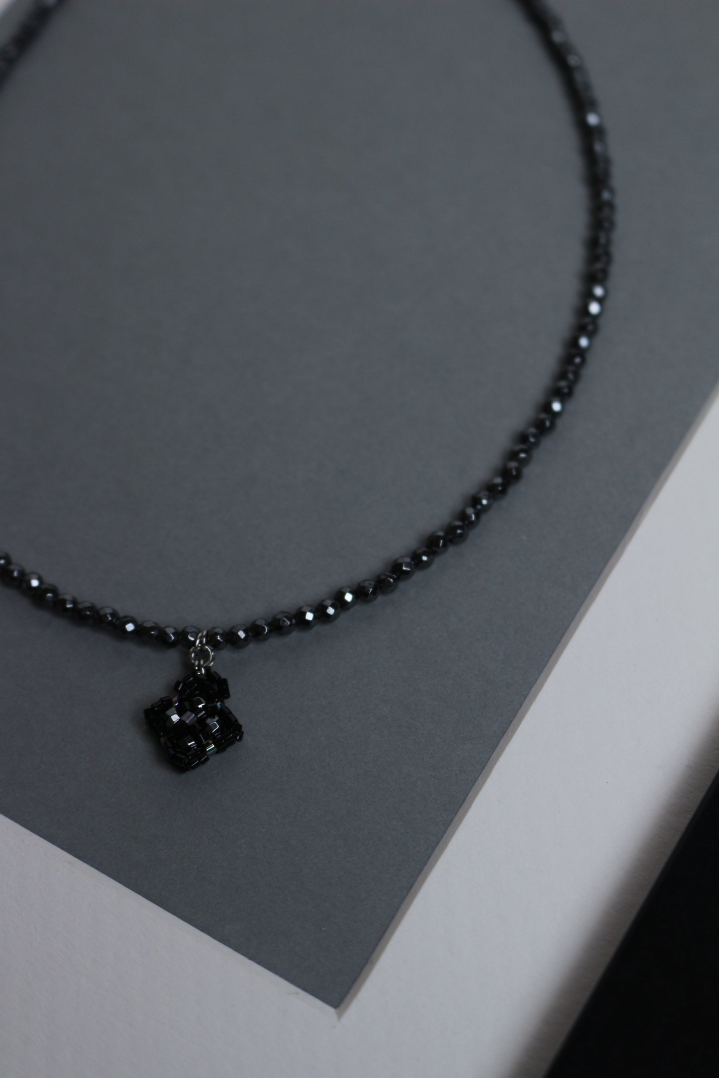 Hematite choker with small beaded element