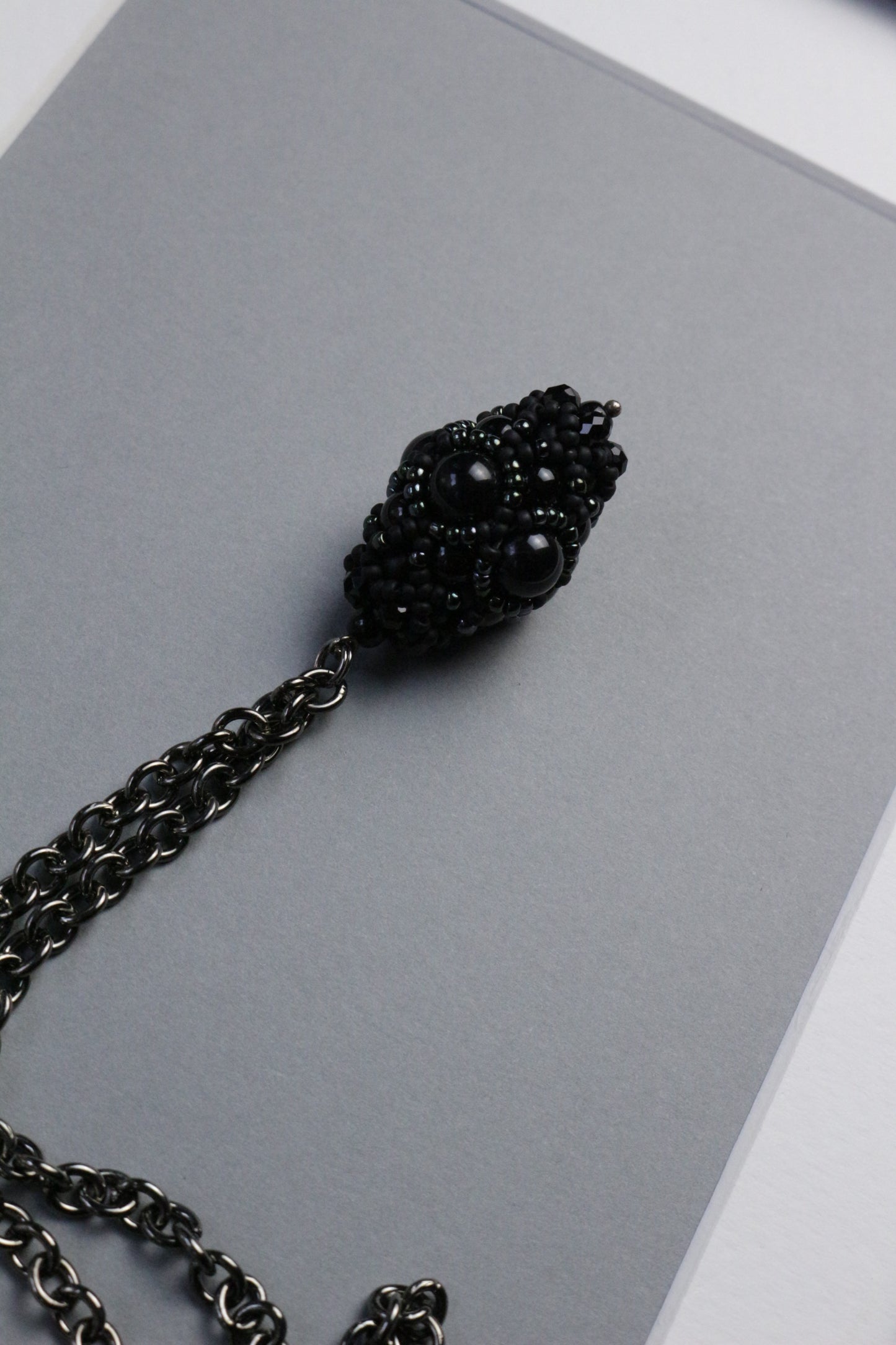 Necklace with black beaded element